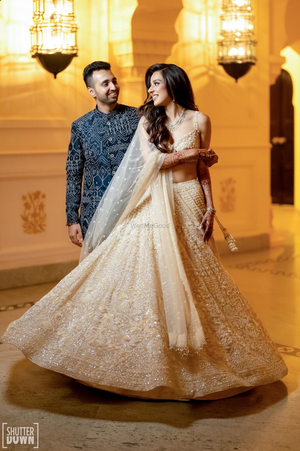 Photo of Pastel lehenga and navy blue bandhgala for cocktail
