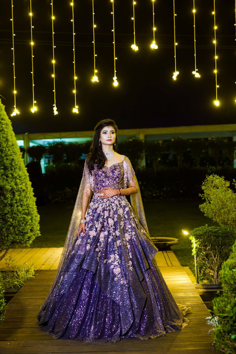 Photo of A bride in a purple shimmery gown for her cocktail