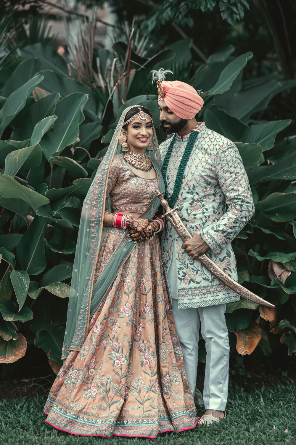 Photo of A picture perfect couple portrait of a sikh bride and groom