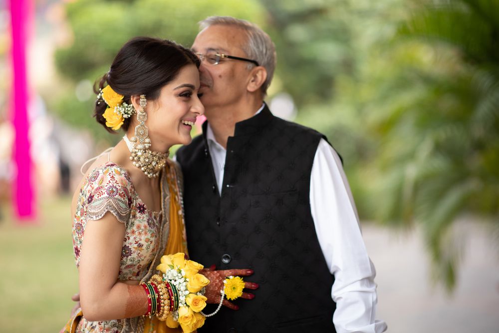 Photo of happy father and daughter shot on mehndi