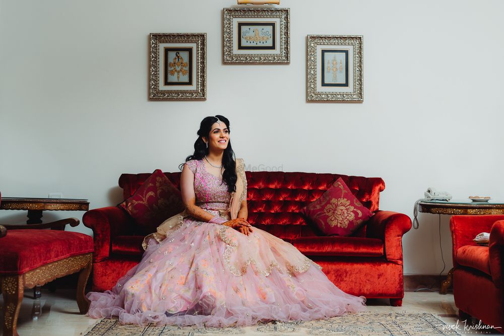Photo of Bride in a dainty light pink lehenga for her engagement
