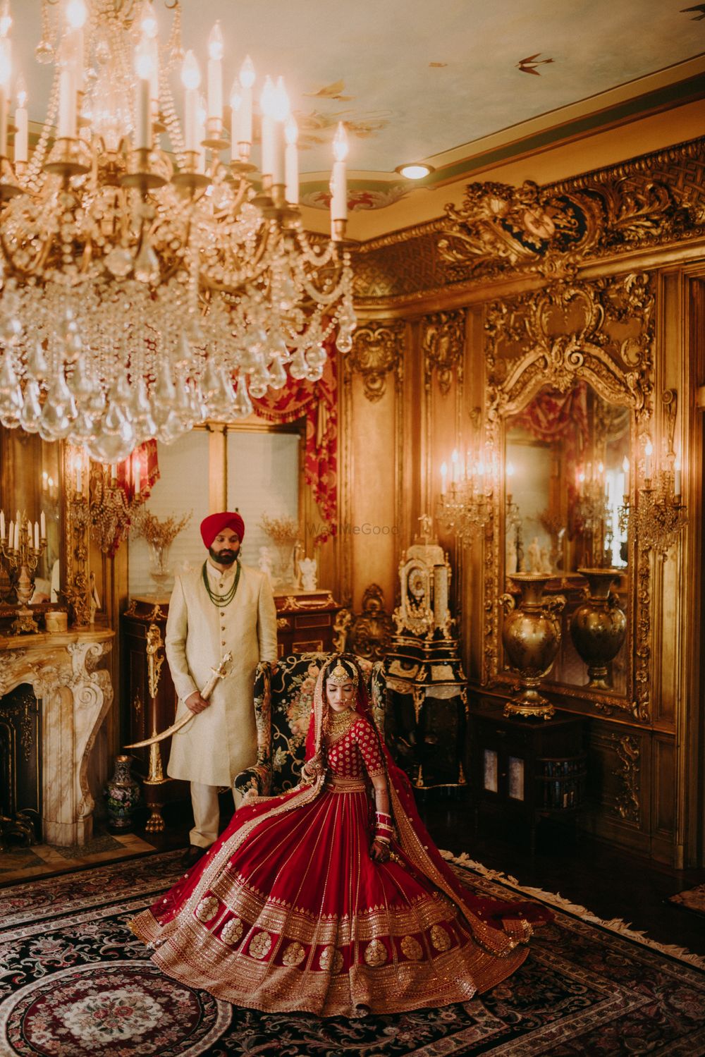 Photo of regal post wedding shot with bride in a red lehenga