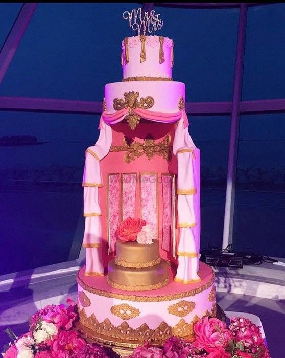Photo of Pink White and Gold Wedding Cake with Multiple Layers
