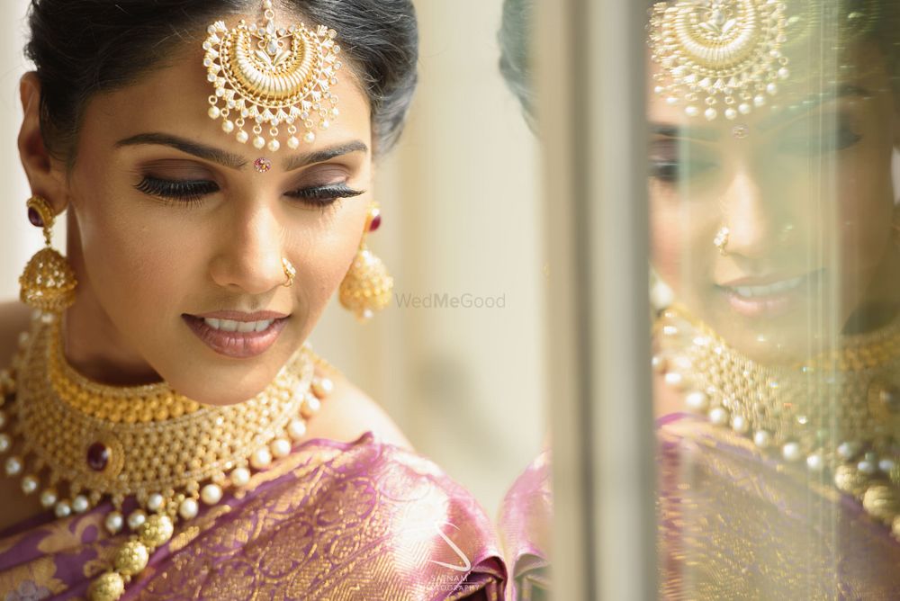 Photo of south indian bridal makeup with pink lids and nude lips