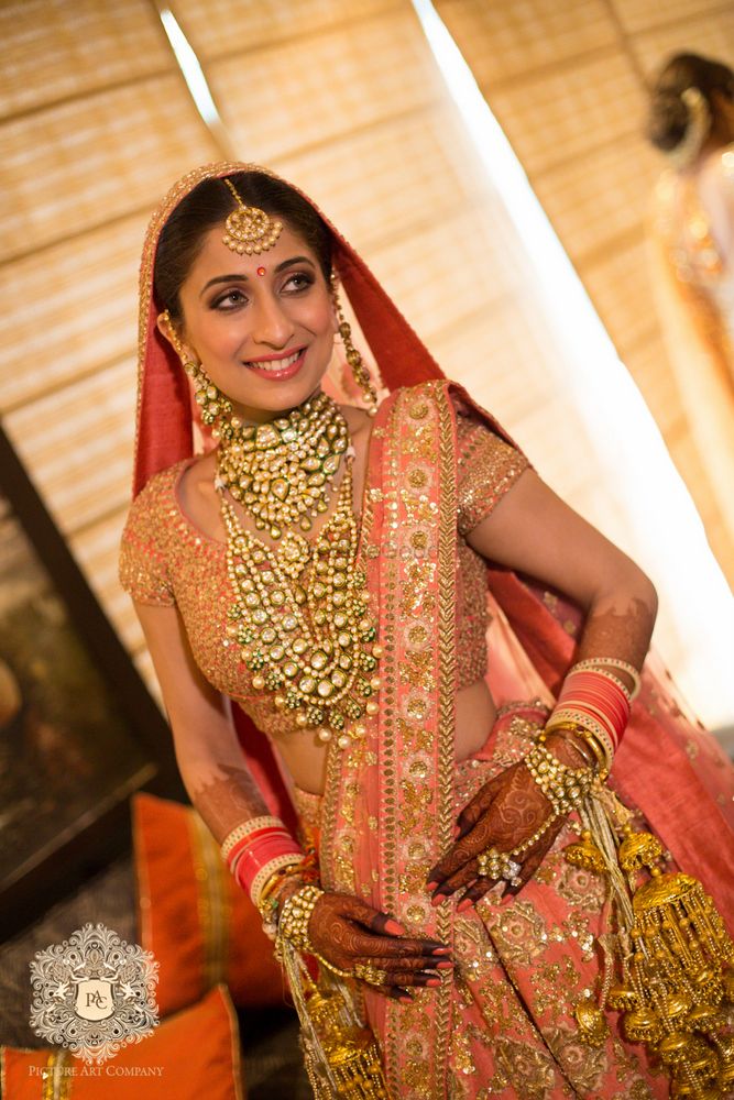 Photo of Pink and gold bridal lehenga