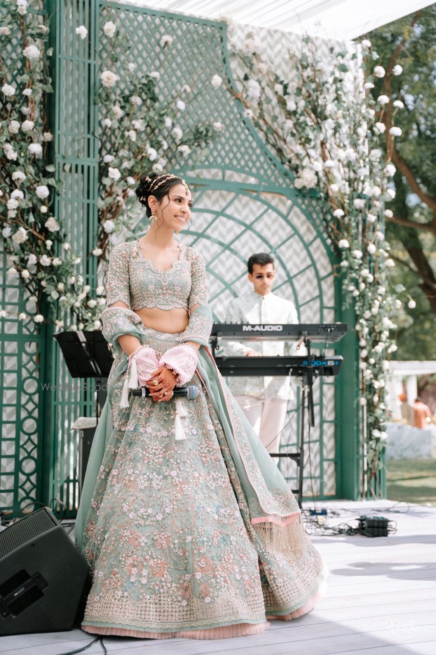 Photo of Gorgeous seafoam pastel lehenga with bride in a double sispatti look