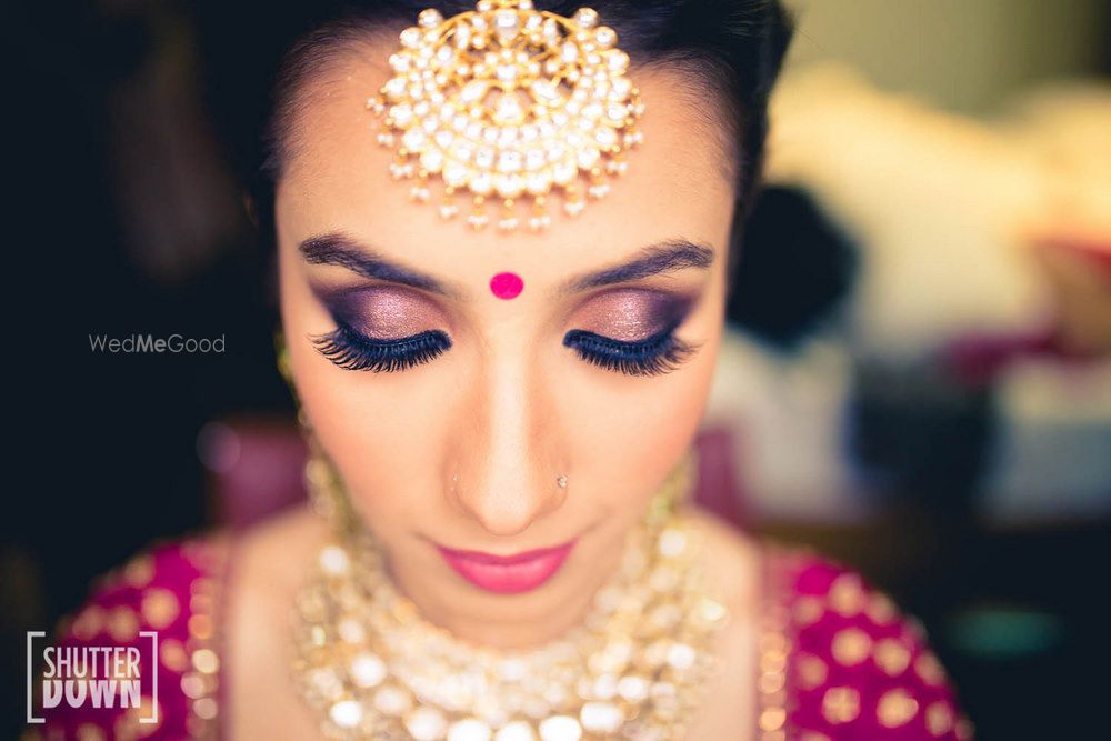 Photo of purple smokey eyes bridal makeup