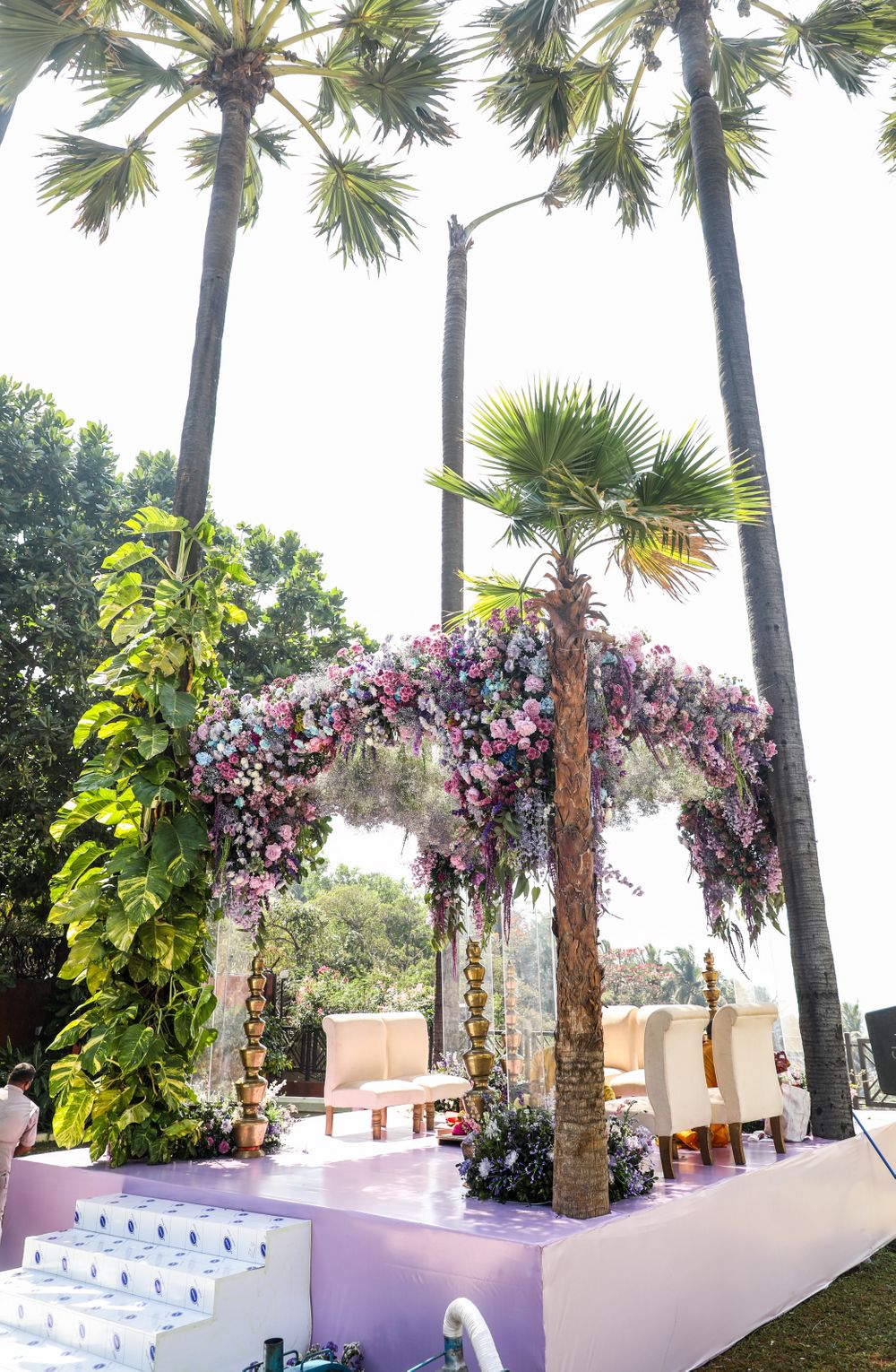 Photo of Mandap top decorated with blue, pink and purple flowers