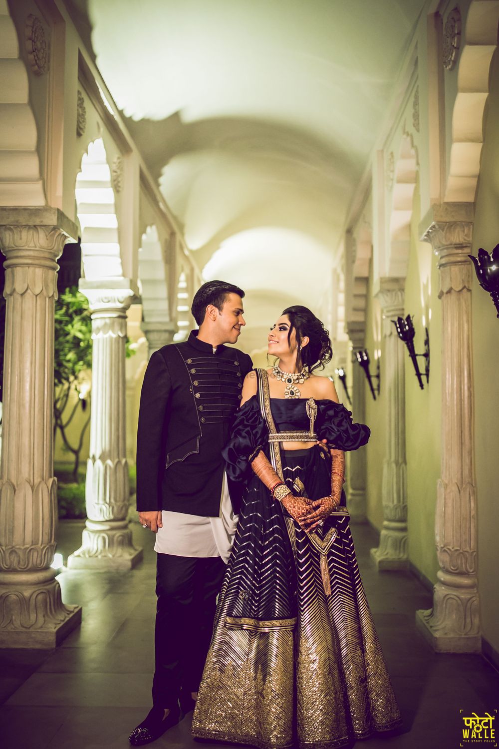 Photo of Black cocktail lehenga with ruffled off shoulder blouse