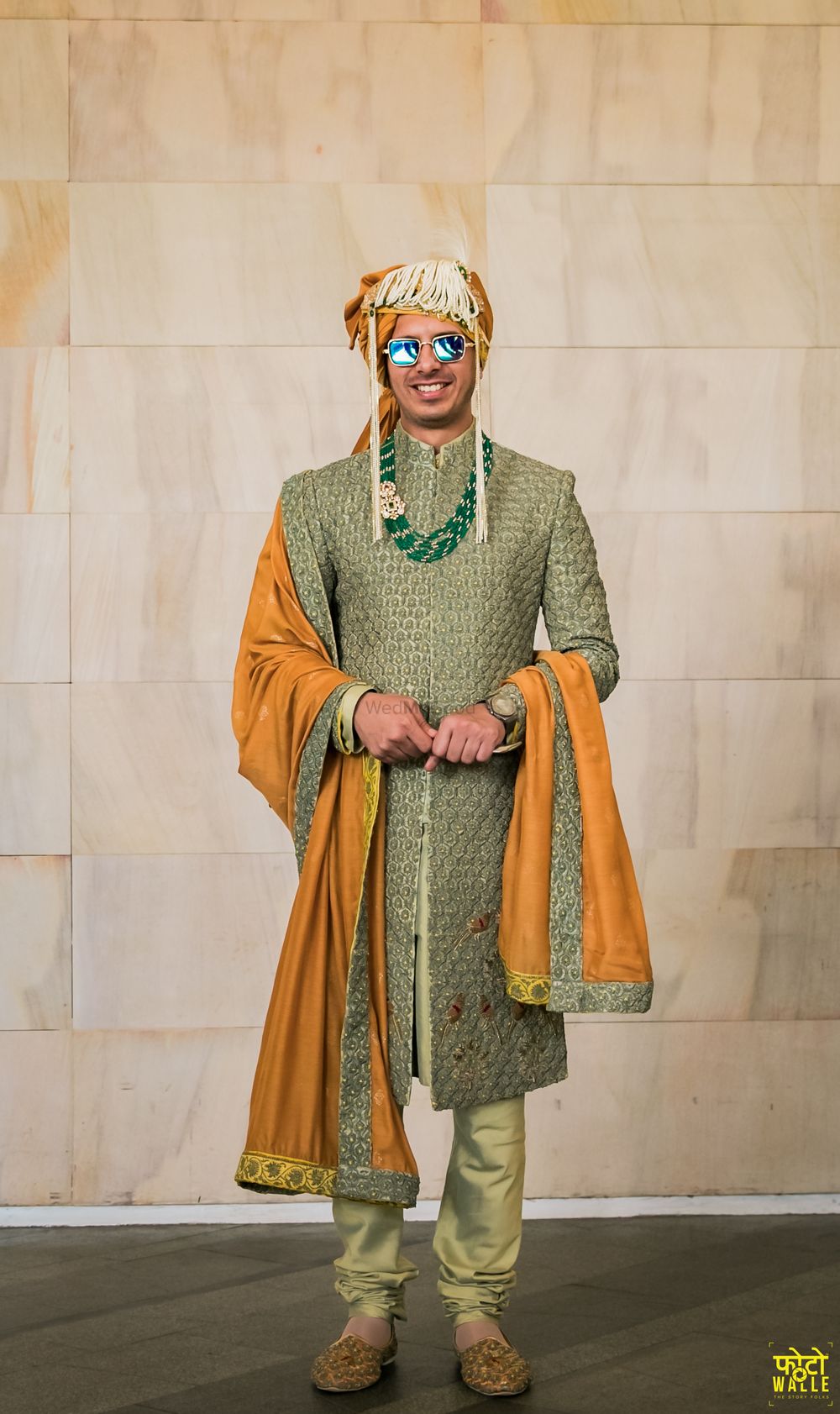 Photo of Groom in an olive green sherwani with a mustard dupatta