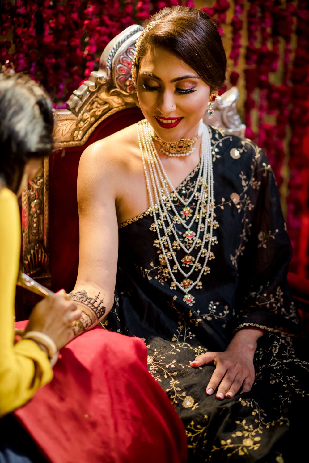 Photo of Bride wearing a black toga on her Sufi night.