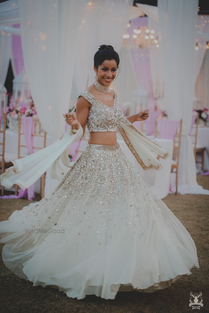 Photo of White and silver engagement lehenga