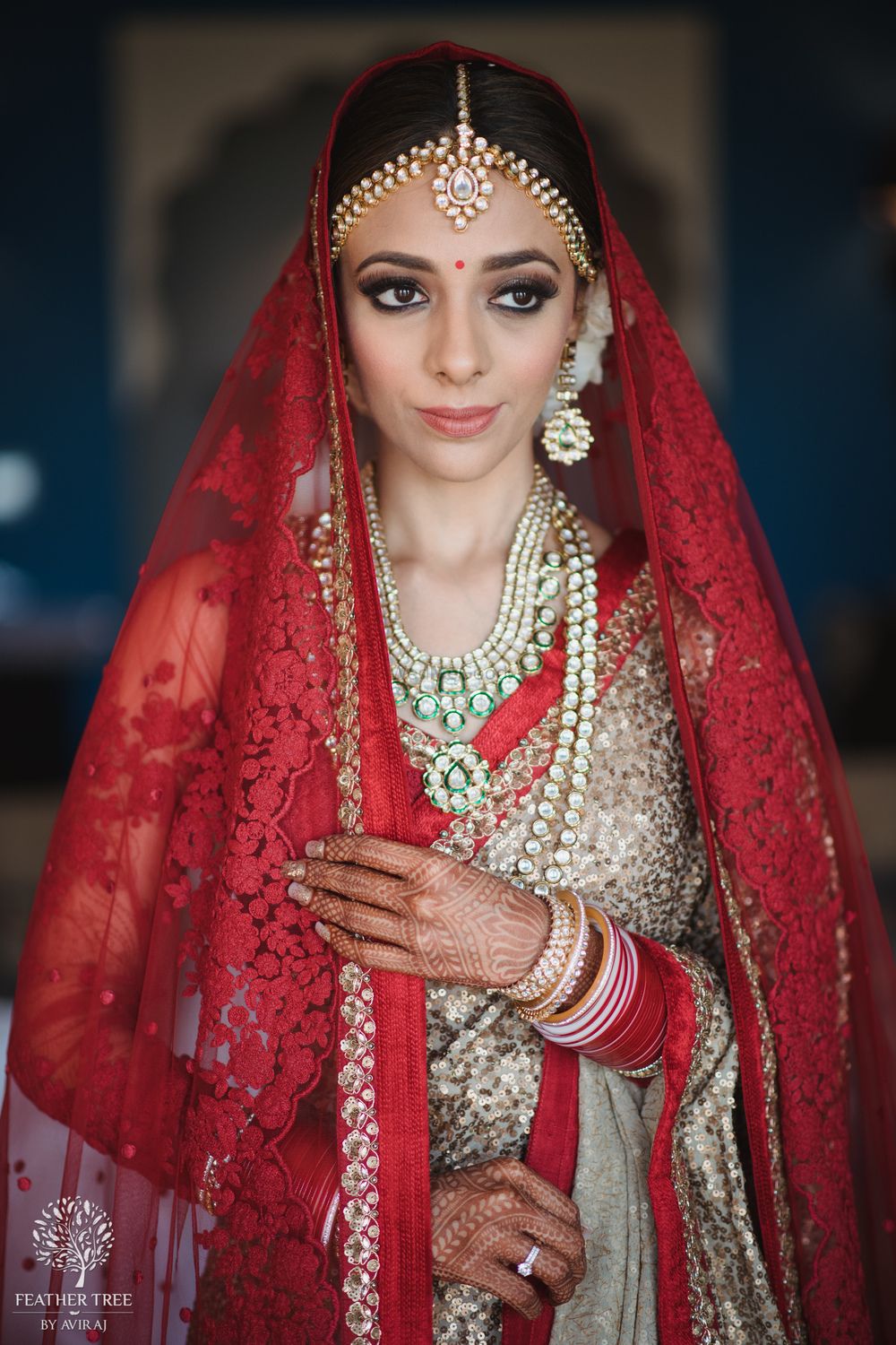 Photo of Wedding day bridal portrait idea in red and gold lehenga