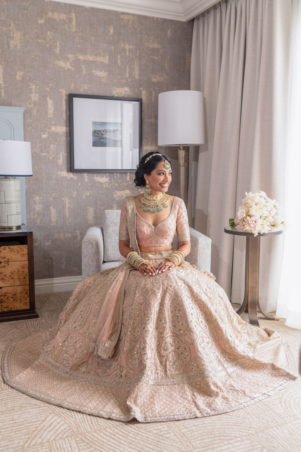 Photo of Bride in soft pastel sabyasachi lehenga in the bridal room