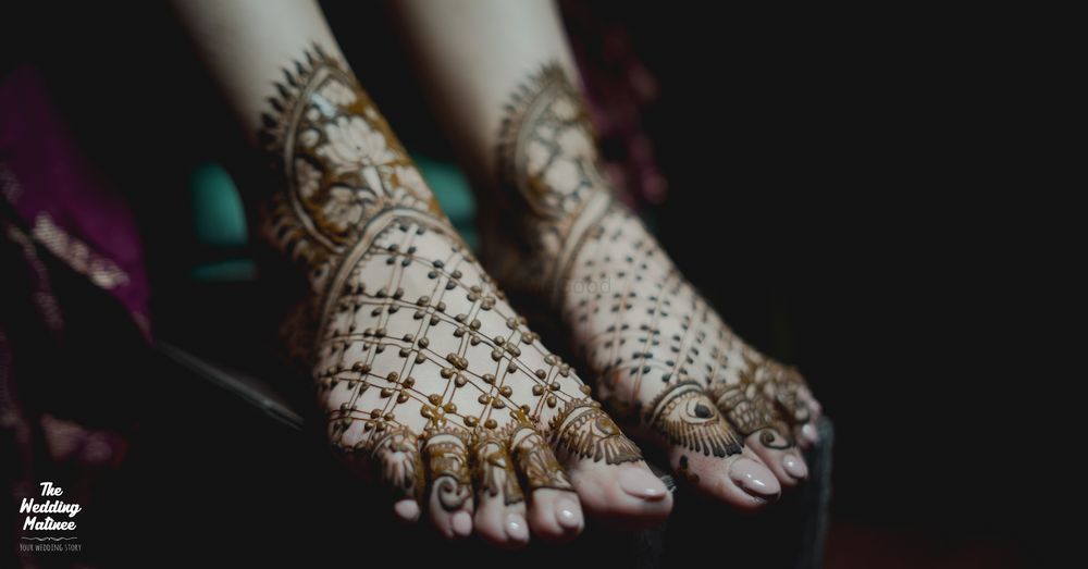 Photo of simple feet mehendi with evil eye motifs