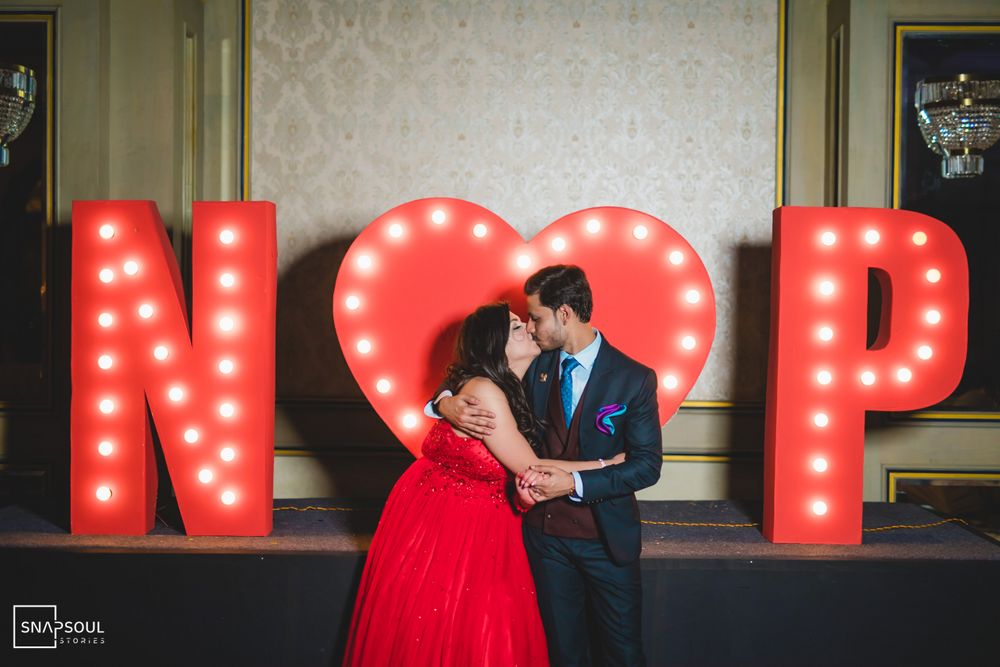 Photo of Couple kissing with their name initials.