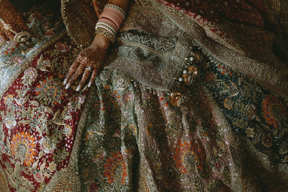 Photo of Gorgeous lehenga shot of the bridal lehenga in multi-coloured panels