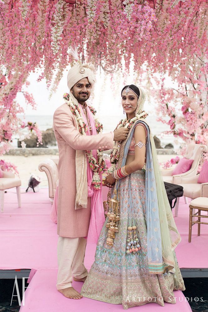 Photo of Beautiful coordinated bride and groom complementing decor