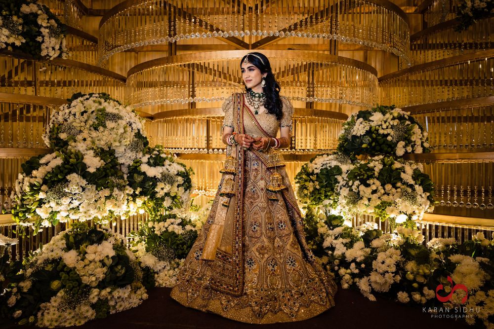 Photo of Bride dressed in an antique gold lehenga for the wedding.