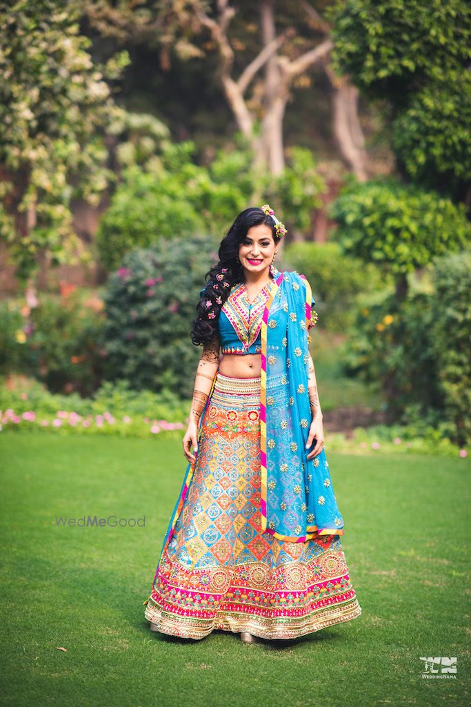 Photo of Bright and happy mehendi lehenga