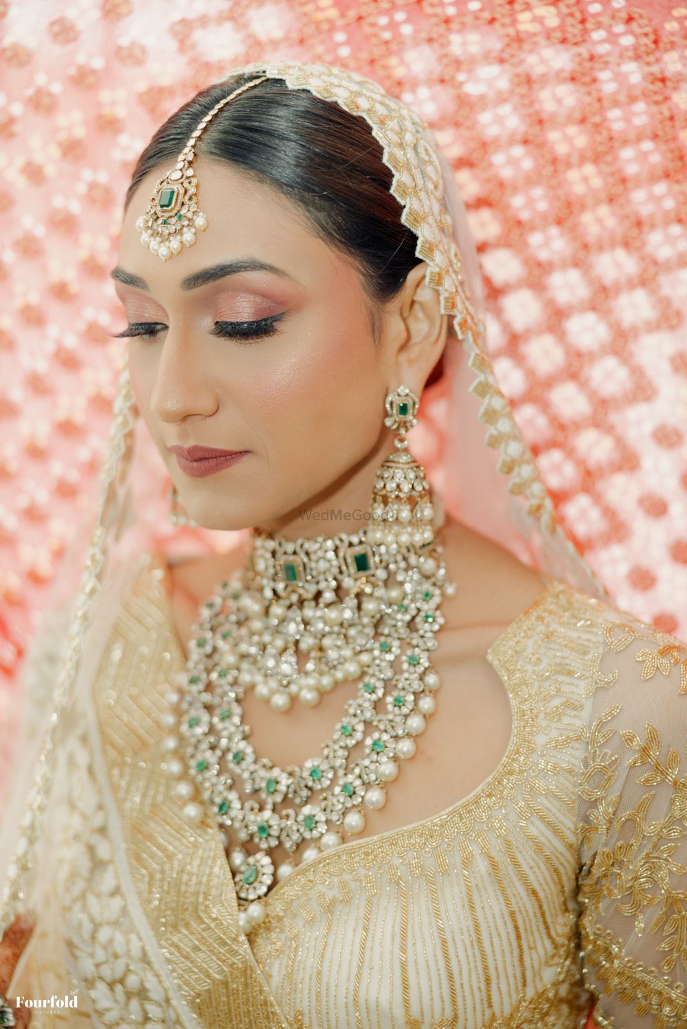 Photo of Lovely bridal closeup with layered jewellery and the most subtle makeup look