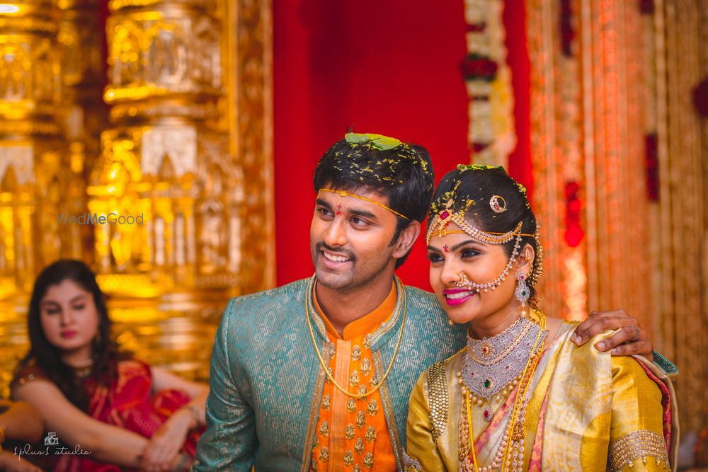 Photo of Groom wear in blue and orange