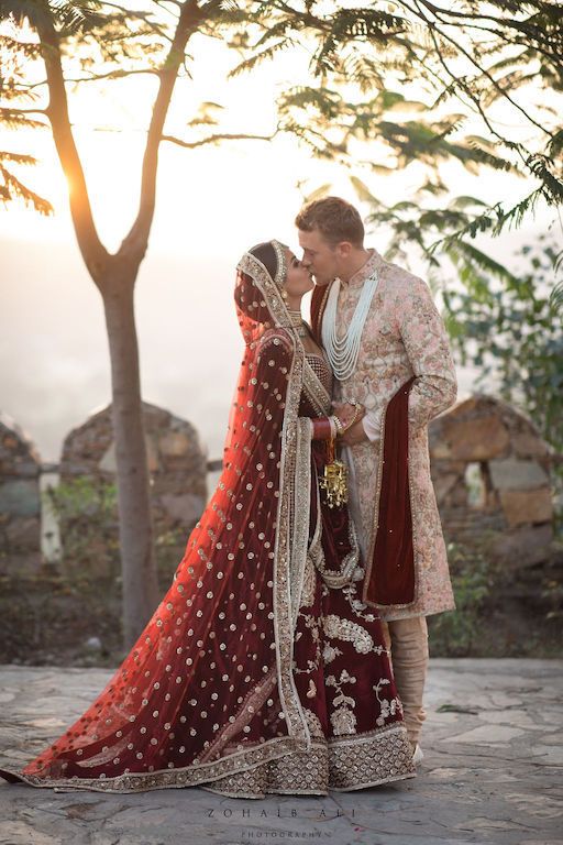 Photo of Sabyasachi bride and groom kissing