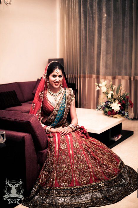 Photo of Sabyasachi bridal lehenga turquoise and red
