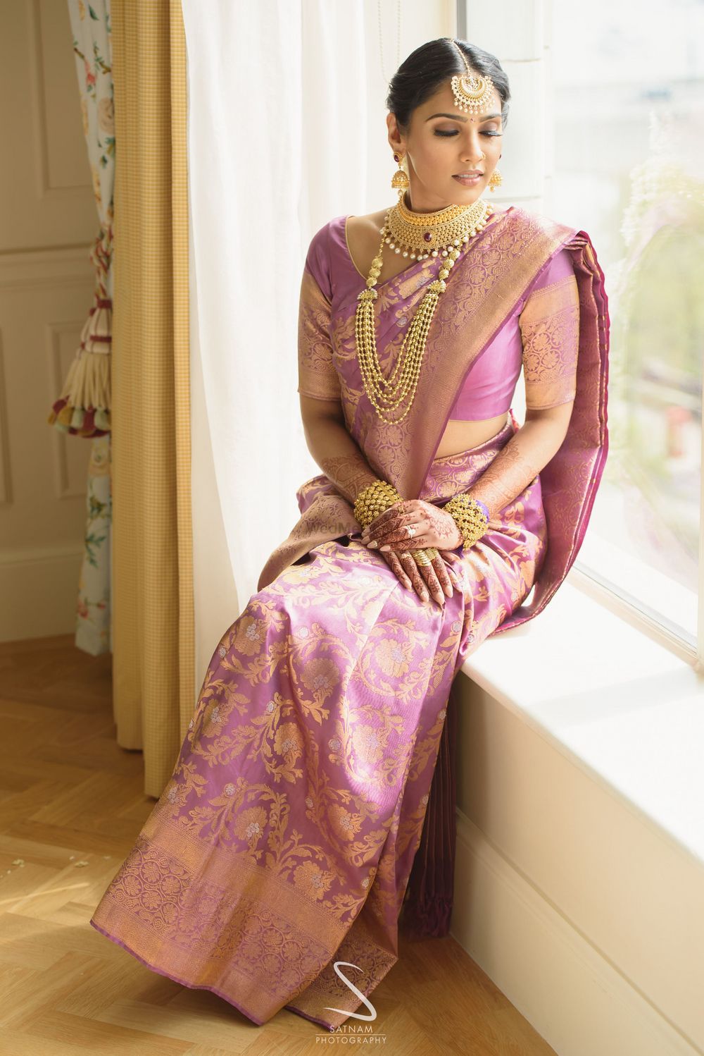 Photo of pretty unique bridal saree in light pink and gold