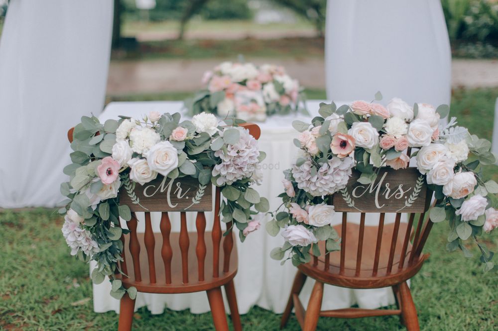 Photo of Floral bride and groom chairs for wedding day