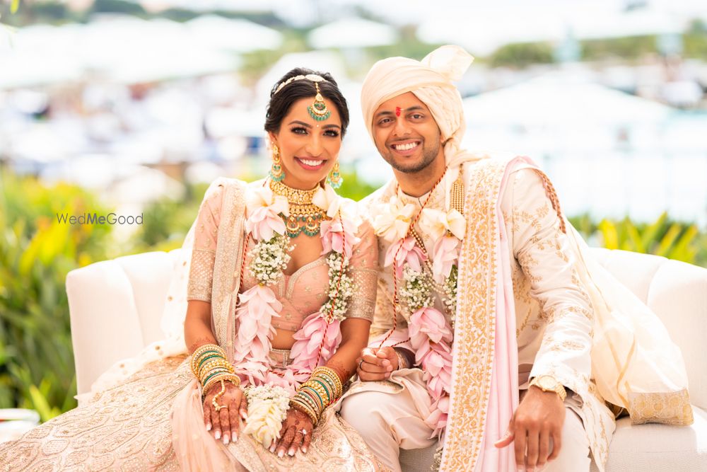 Photo of Bright and happy couple shot with both in matching pastel outfits