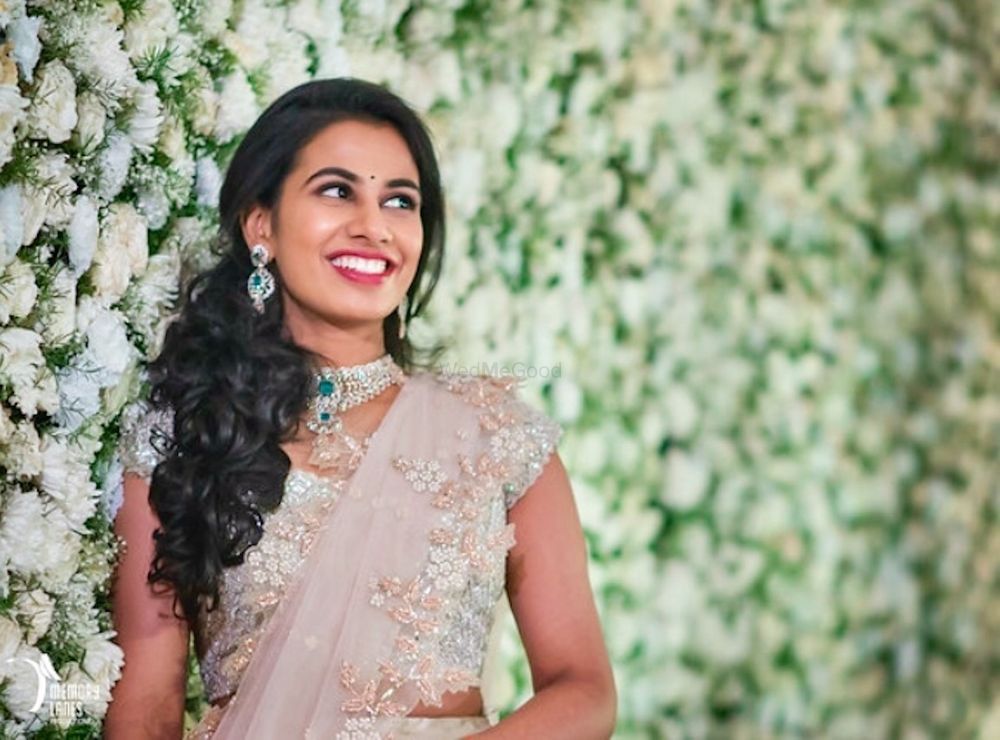 Photo of Bridal portrait against floral wall backdrop
