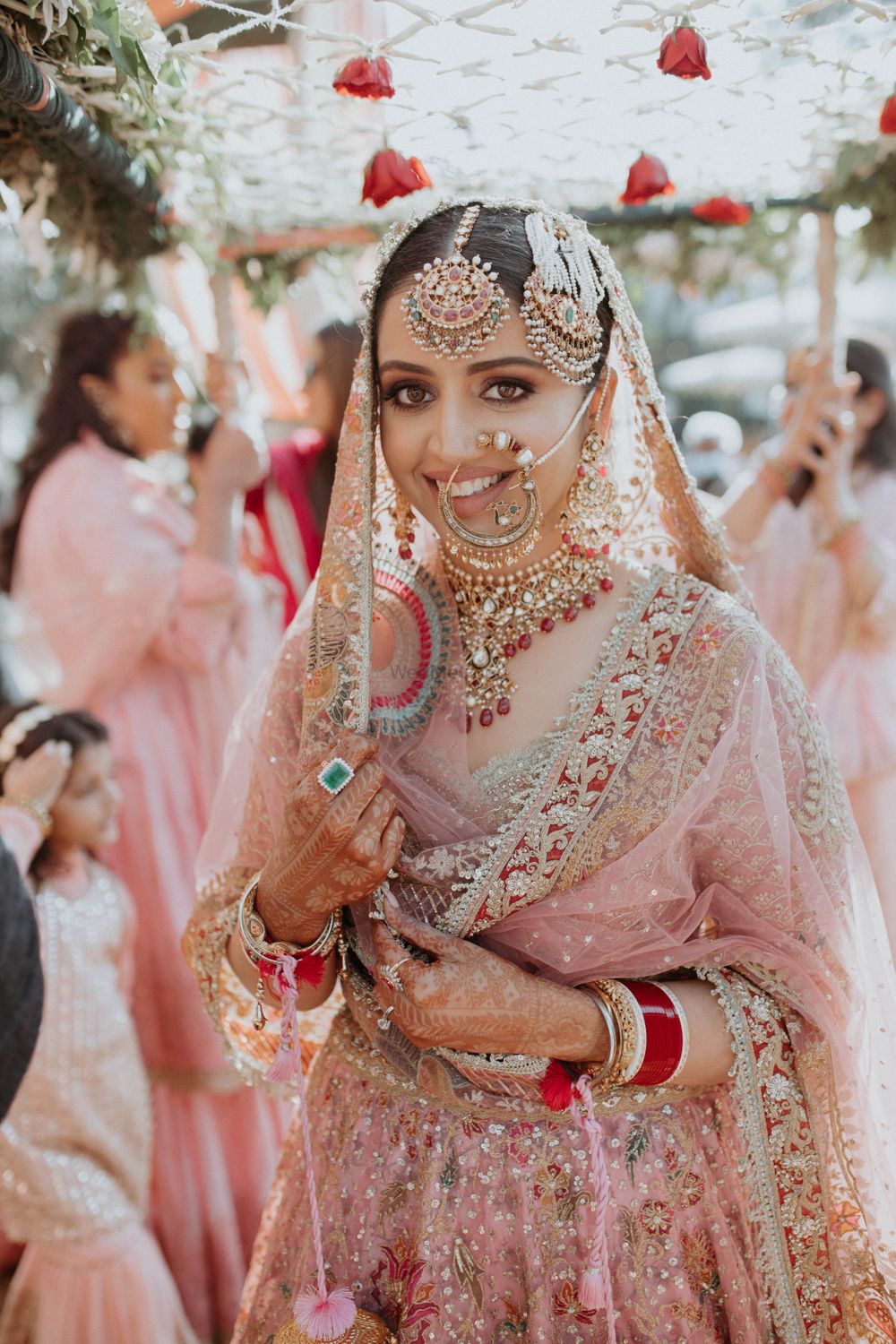 Photo of bride in pink lehenga during anand karaj