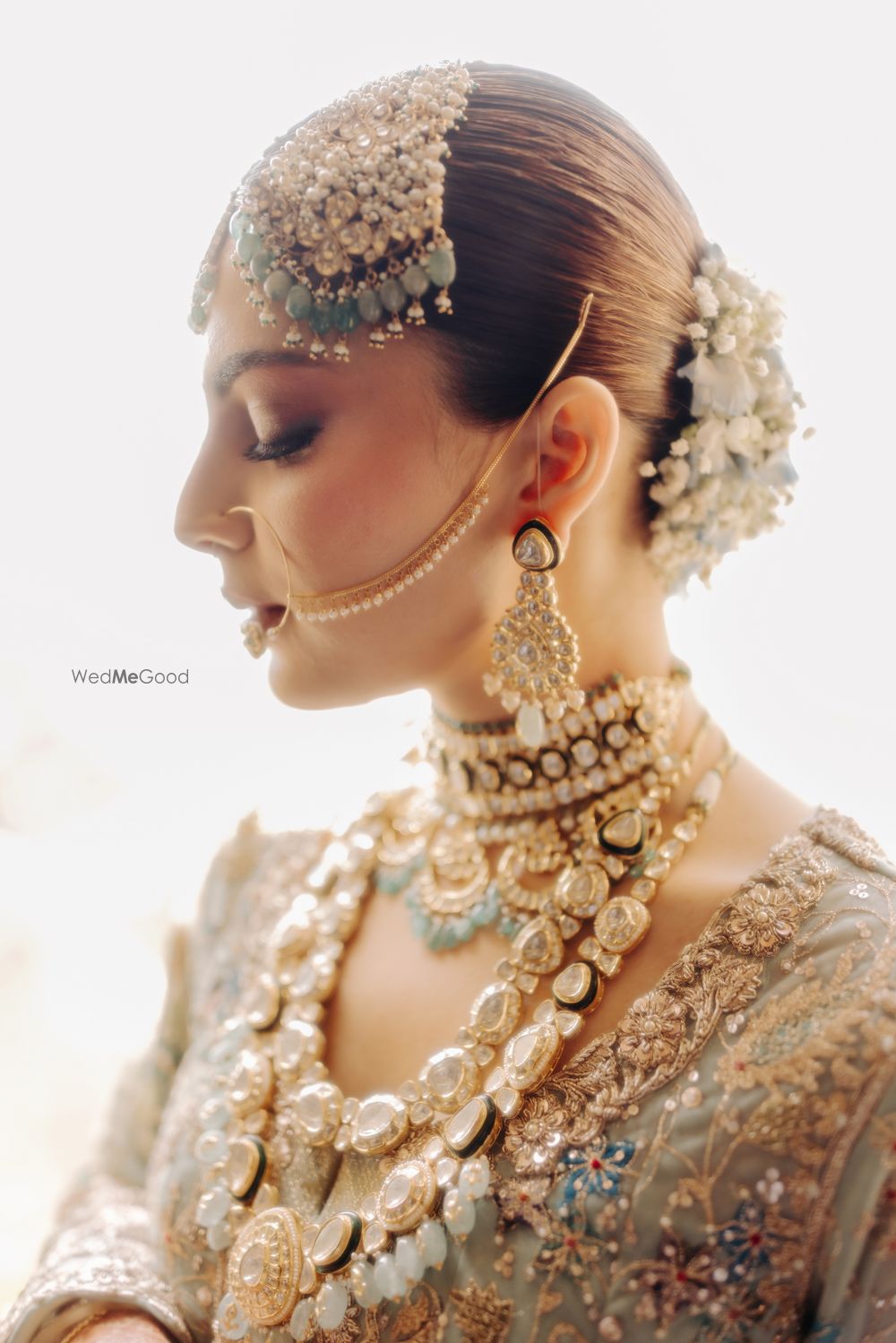 Photo of Wedding day portrait with the bride donning heavy polki and uncut diamond jewellery