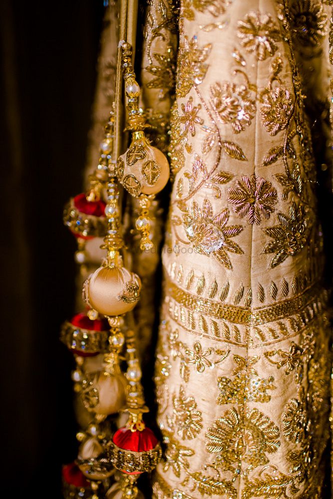 Photo of Gold and cream bridal lehenga with zardozi