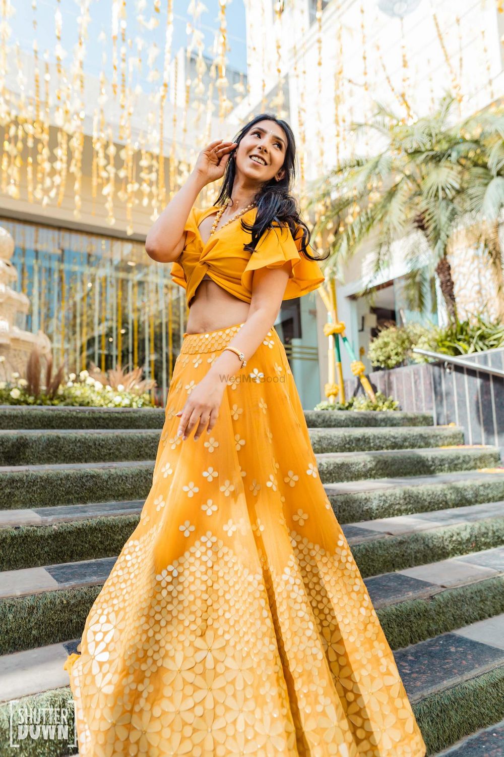 Photo of Yellow Mehndi lehenga with a ruffled blouse