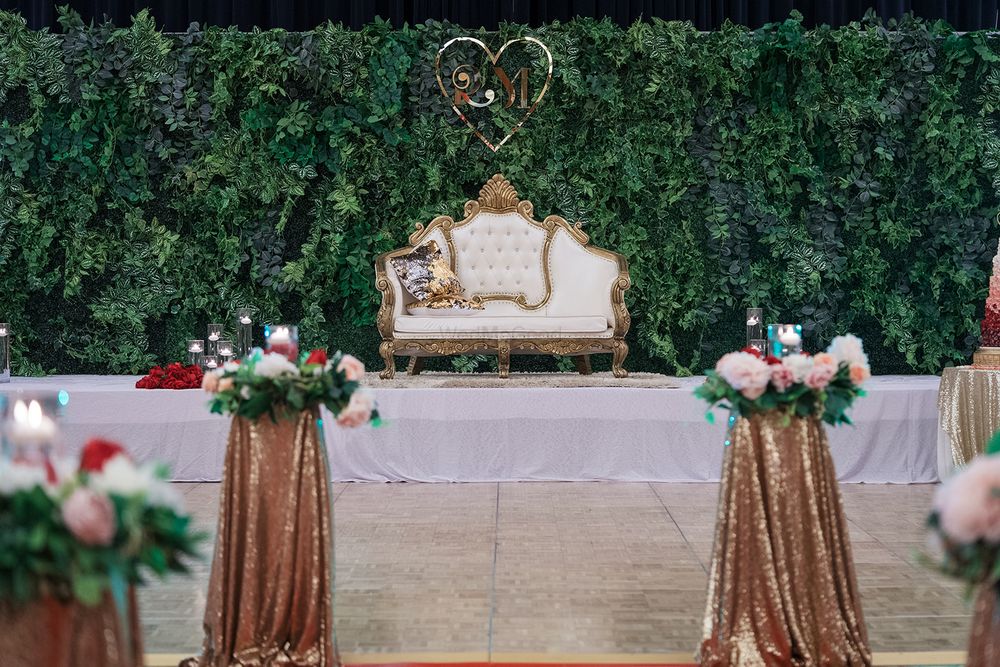 Photo of Simple yet stunning stage decor with a green backdrop