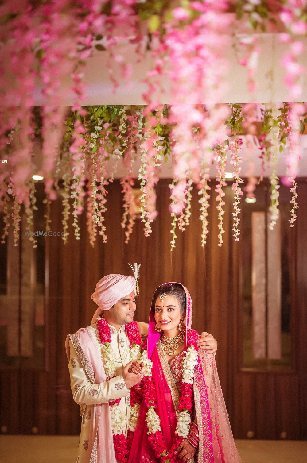 Photo of Stage decor for wedding with hanging floral strings