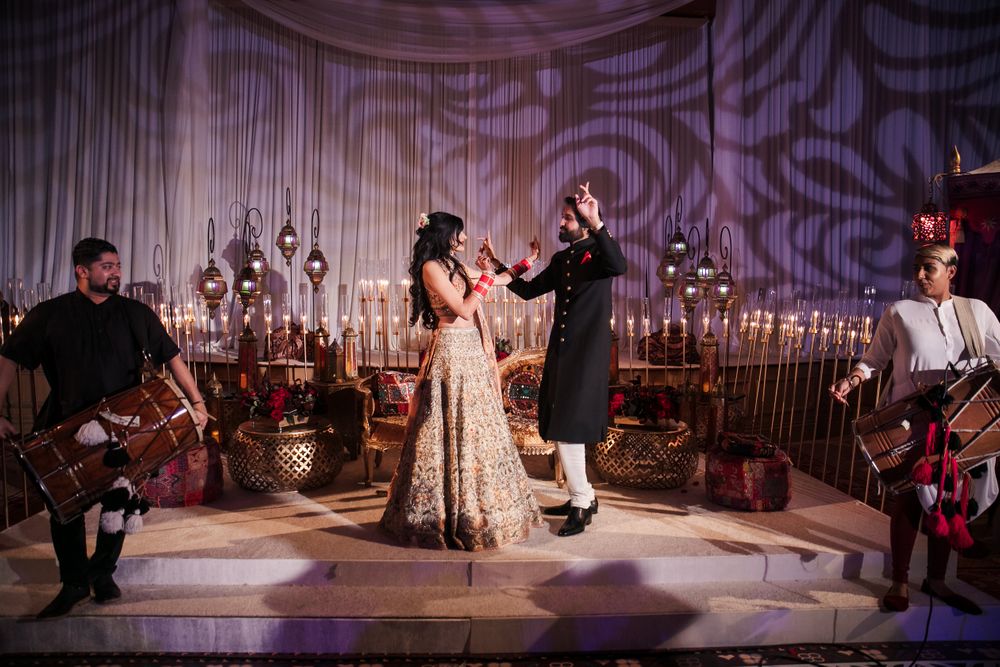 Photo of Couple dancing shot on stage for their sangeet