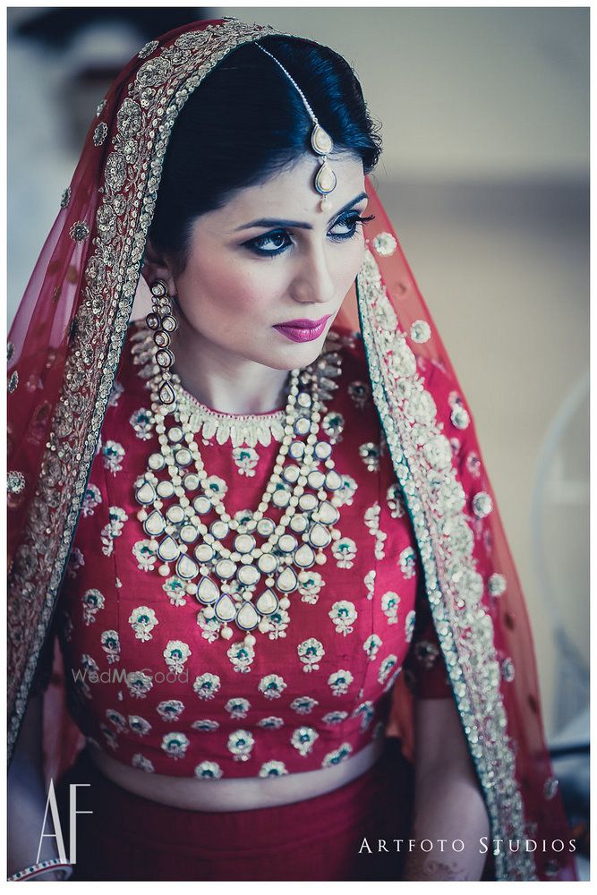 Photo of Bridal portrait wih bride in sabyasachi