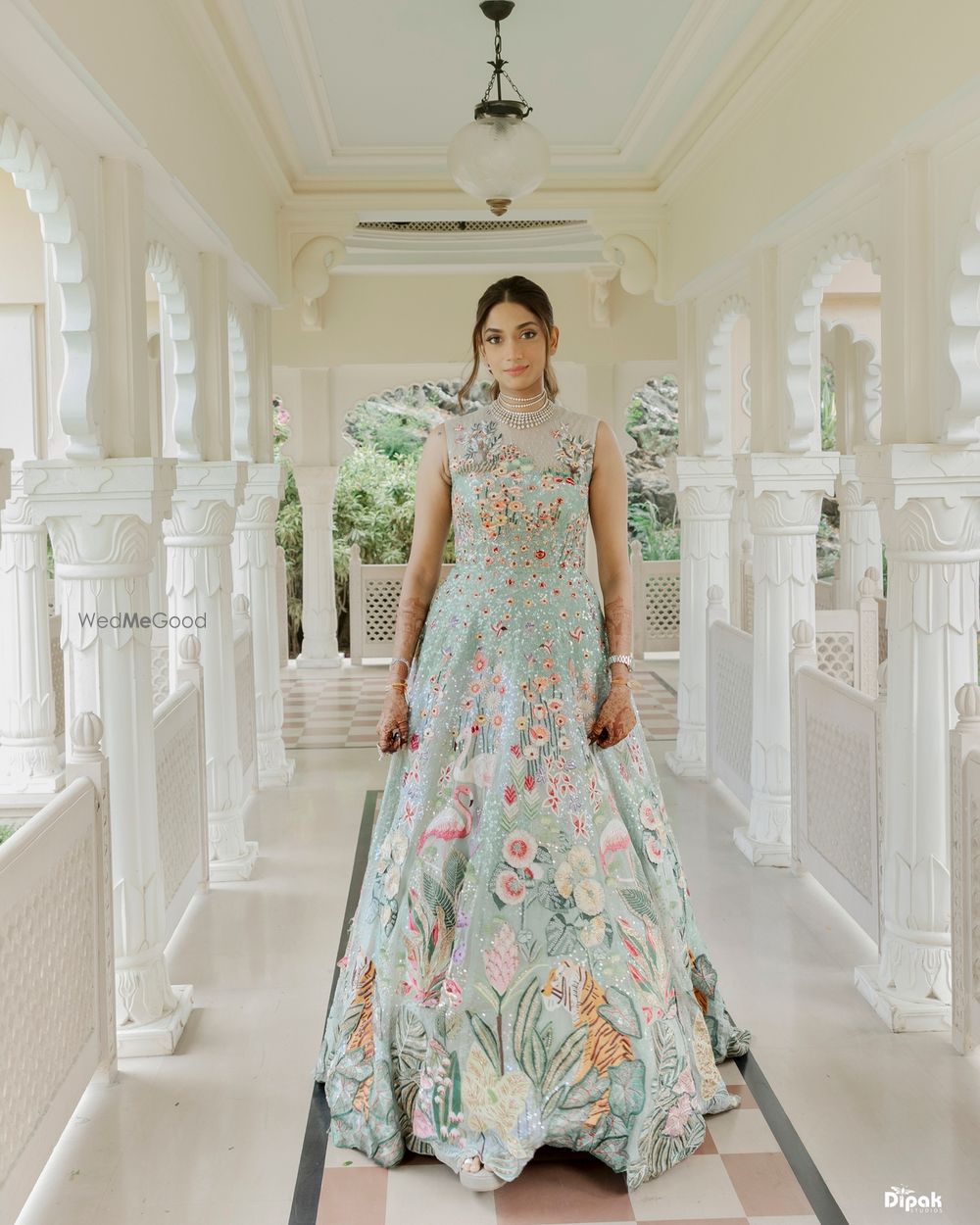 Photo of Gorgeous gown in powder blue with floral detailing and diamond jewellery