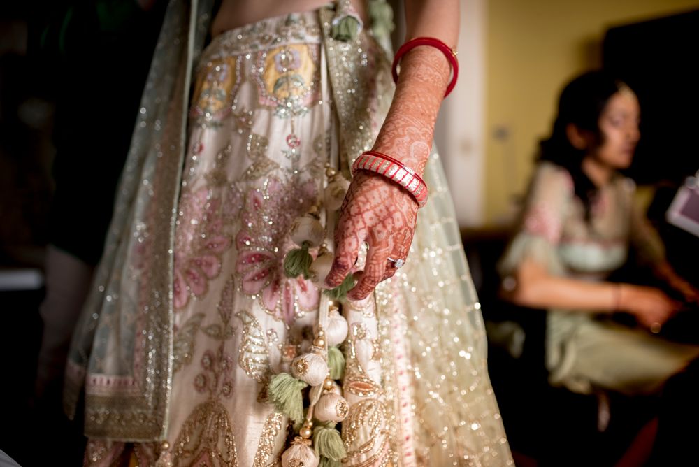 Photo of A blush pink pastel lehenga with latkans in pastel colours!
