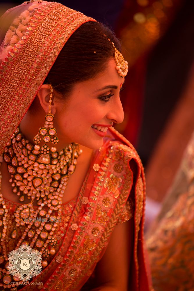 Photo of Pink and gold bridal portrait