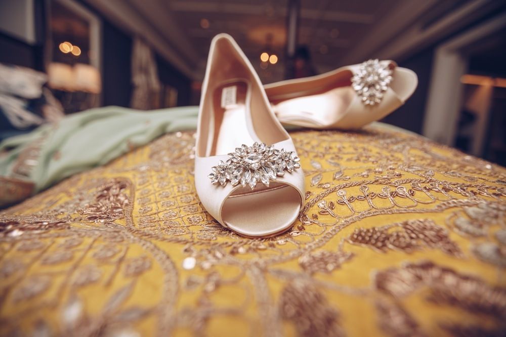 Photo of Off white embellished bridal shoes