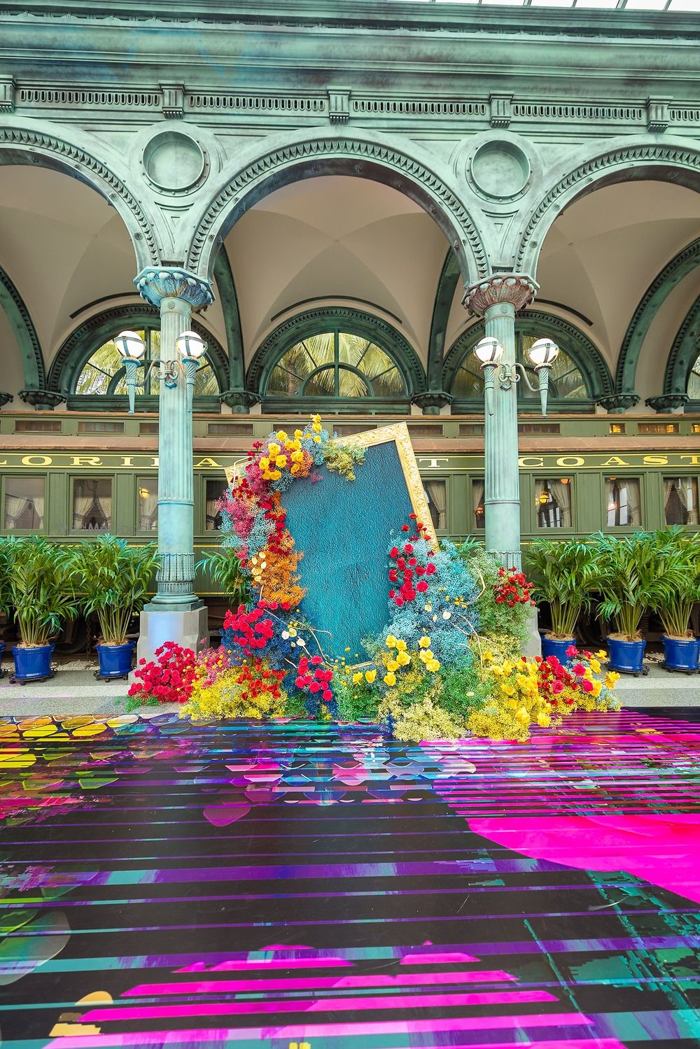 Photo of Unique floral decor with multi coloured flowers and printed floor