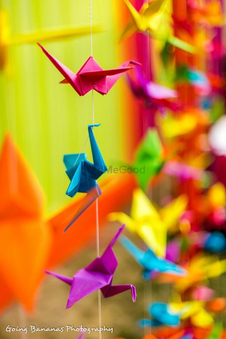 Photo of paper origami cranes made to provide a backdrop of the vedi