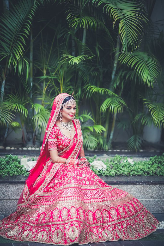 Photo of Red and gold Sabyasachi bridal lehenga with floral motifs