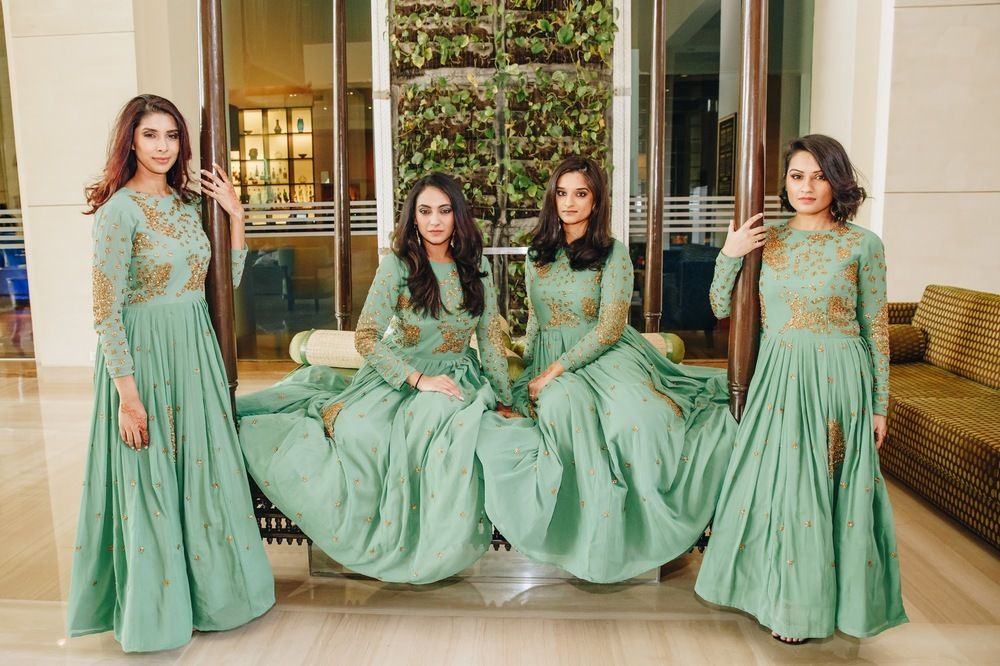 Photo of Coordinated bridesmaids in green anarkalis