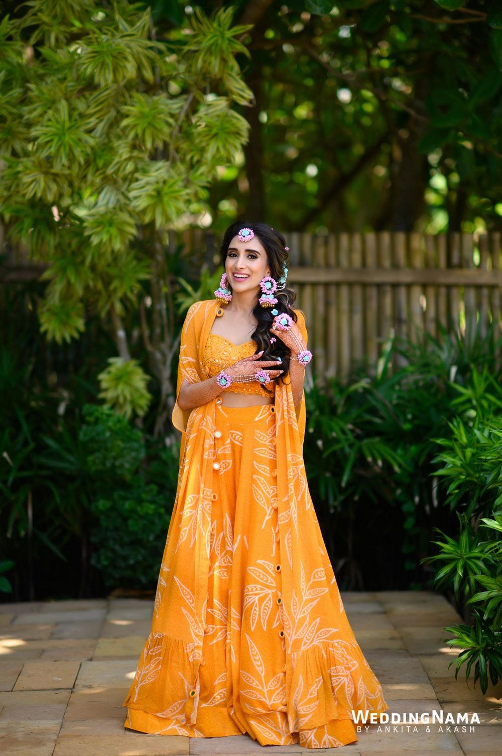 Photo of Breezy bridal Haldi look in yellow co-ords with a jacket and floral jewellery