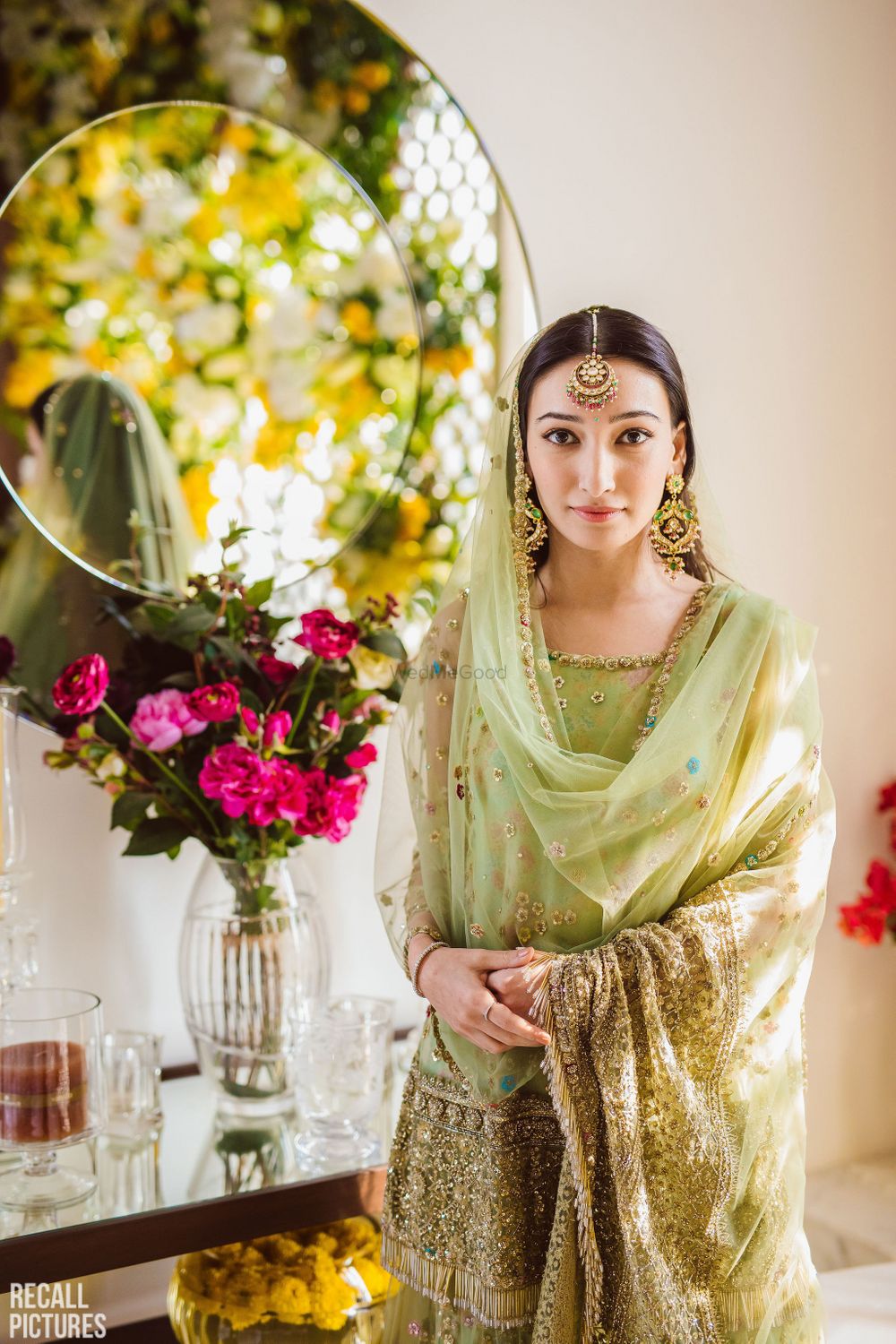 Photo of A to-be-bride in a green sharara for her roka ceremony